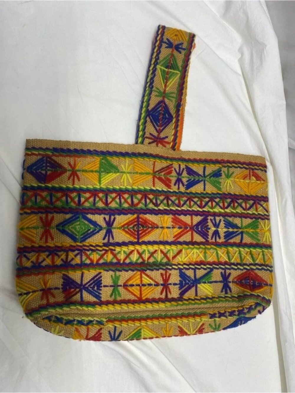 vintage 1970s boho-style tote bag embroidery on a woven burlap or jute base